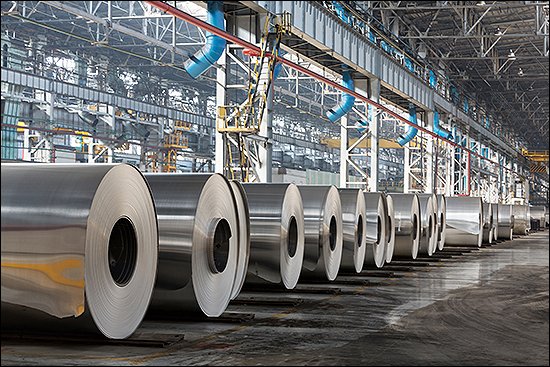 Row of rolls of aluminum lie in production shop of plant. Row of rolls of aluminum lie in production shop of plant.